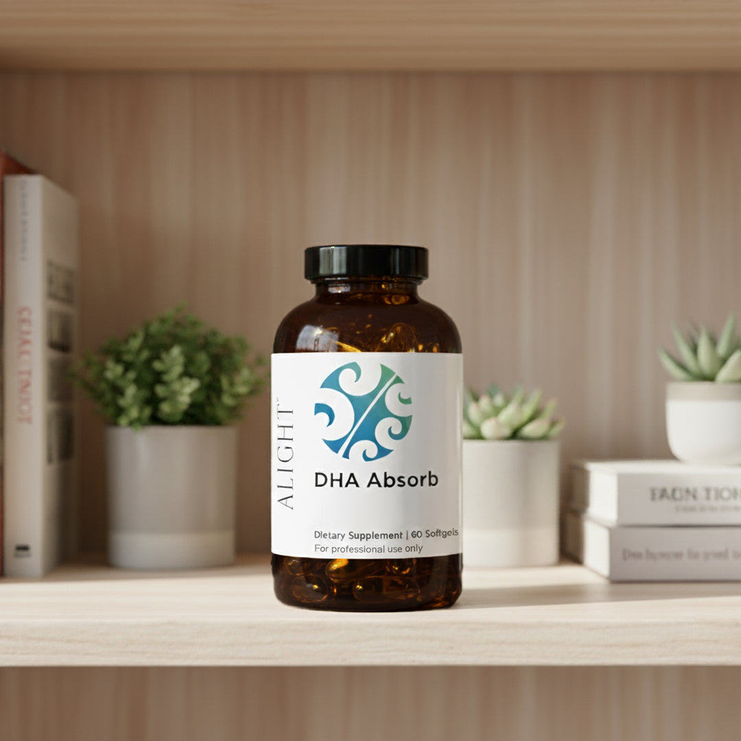 Bottle of DHA Absorb supplement on a shelf with plants and books in the background