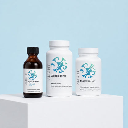 Three ALiGHT-branded supplement products displayed on a white pedestal against a light blue background: an amber bottle labeled MycoReset, a white bottle labeled Gentle Bind, and a white bottle labeled MoldBiotic.