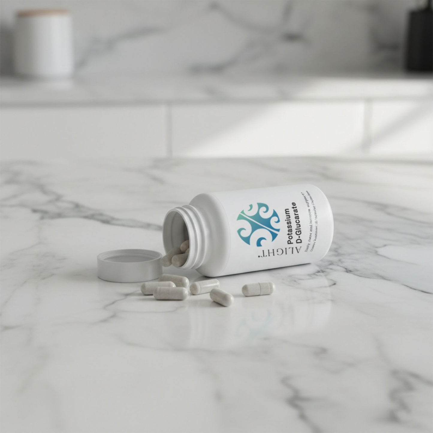 Open white supplement bottle with pills on a marble surface
