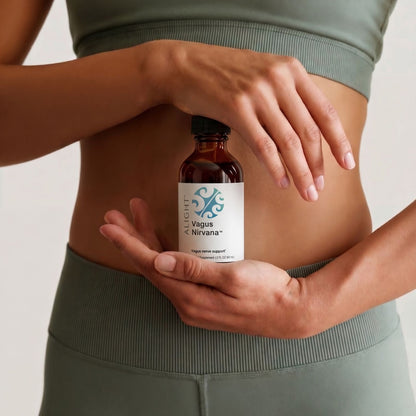 Person holding a bottle labeled 'Vagus Nirvana' against a neutral background