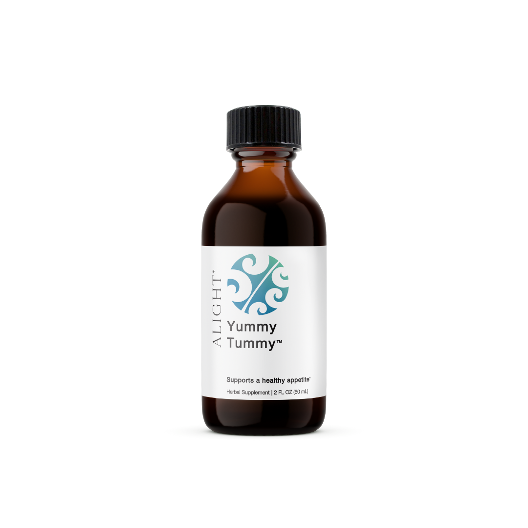 Bottle of 'Yummy Tummy' supplement with a black cap on a white background
